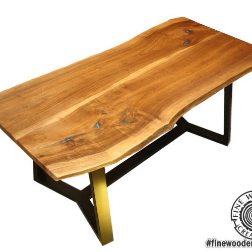 Live edge dinning table glowing in the dark with powder painted legs