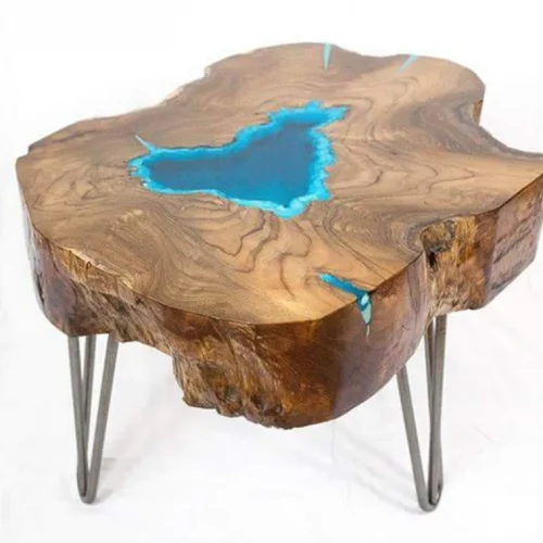 Round live edge coffee table with glowing resin fillin and hairpin legs