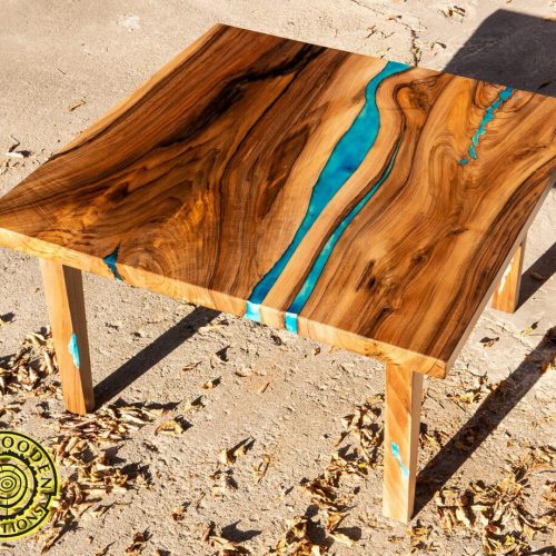 Square resin and walnut coffee table with glowing resin wooden legs