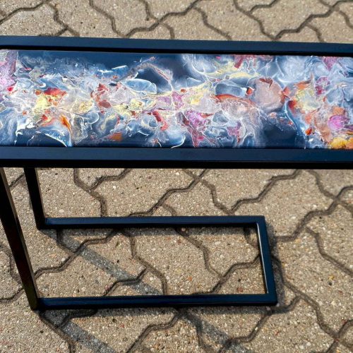 Resin cast end table on metal C shaped legs, abstract design, blue, red, gold, white