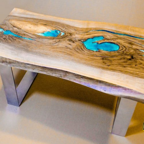 Live edge coffee table with silver matt legs and glowing resin