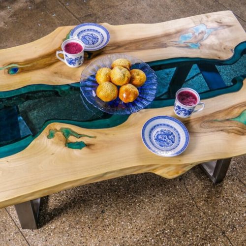 Live edge river coffee table with glowing resin and metal base