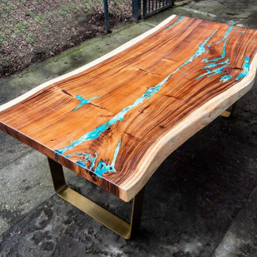 Dining table with resin and live edge made of suar wood